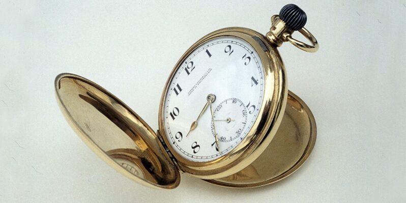 Gold pocket watch with white clock face
