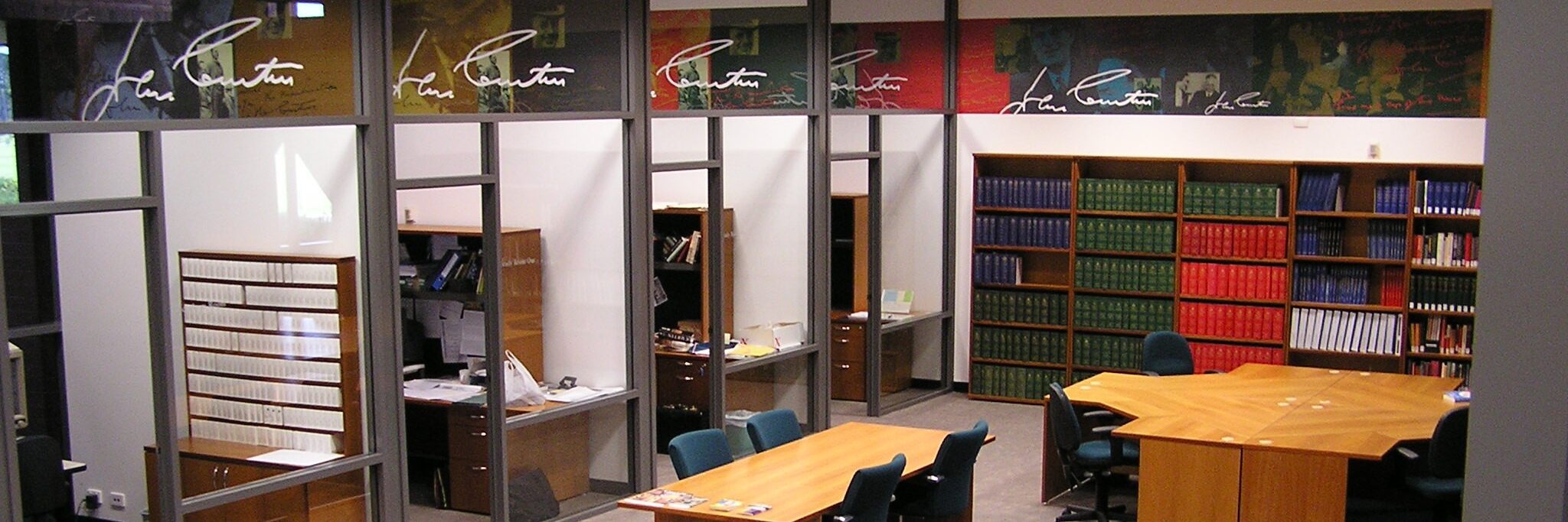 Aerial shot of desks, bookshelves and computers available in the JCMPL reading room