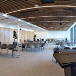 Panorama view of The Lantern event space. View of lecturn, chairs and tables.