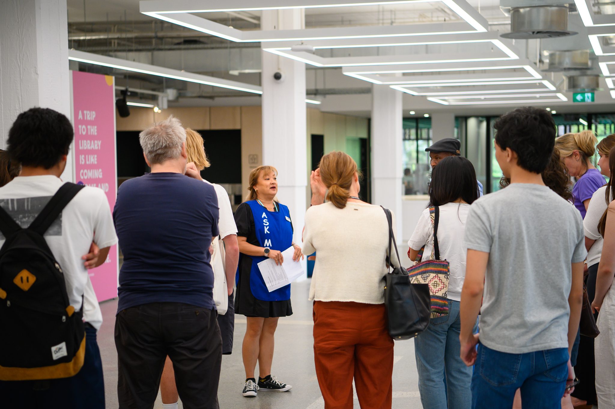 Staff member giving a tour to students in TL Robertson Library.