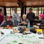 Library staff member running a Mobile Makerspace Workshop to a group of regional students